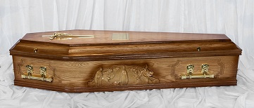 Panelled oak finished coffin with "Our Lady of Knock" figures